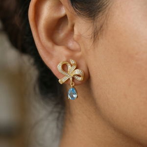 AGOR Graceful Bow Light Blue Drop Earrings in 925 Sterling Silver with Gold Finish - Chic Women's Jewellery