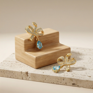 AGOR Graceful Bow Light Blue Drop Earrings in 925 Sterling Silver with Gold Finish - Chic Women's Jewellery