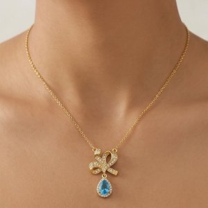 925 Sterling Silver Ribbon Bow Pendant Necklace Jewellery with Blue Stone in Gold Plated Finish
