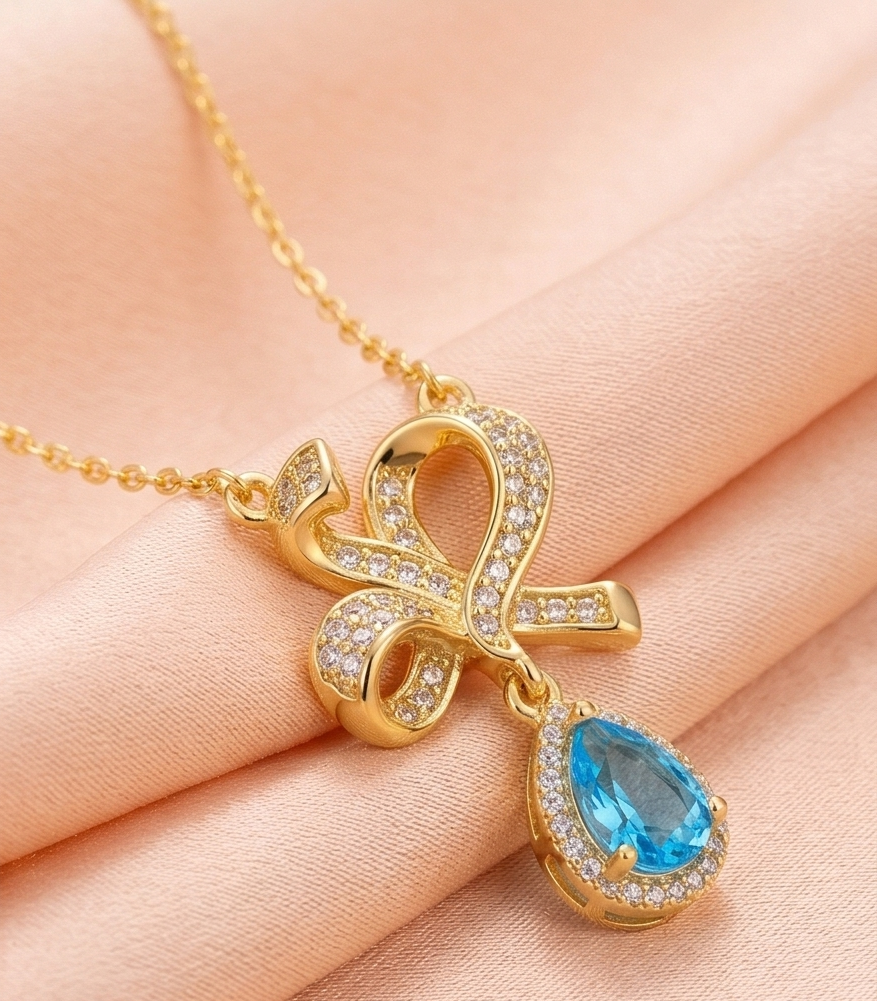 925 Sterling Silver Ribbon Bow Pendant Necklace Jewellery with Blue Stone in Gold Plated Finish