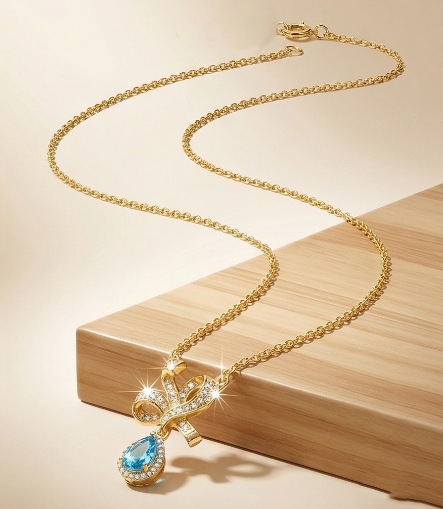 925 Sterling Silver Ribbon Bow Pendant Necklace Jewellery with Blue Stone in Gold Plated Finish