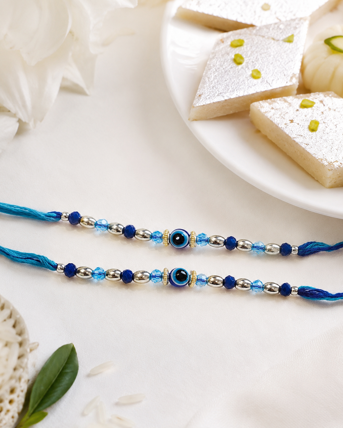 DivoRama Set of 2 Evil Eye Rakhi for Brother | Delicate Blue Nazariya Bead Rakhi with Silver Accents | Designer Nazar Rakhi for Bhaiya Bhai | Raksha Bandhan 2026 Thread Rakhi